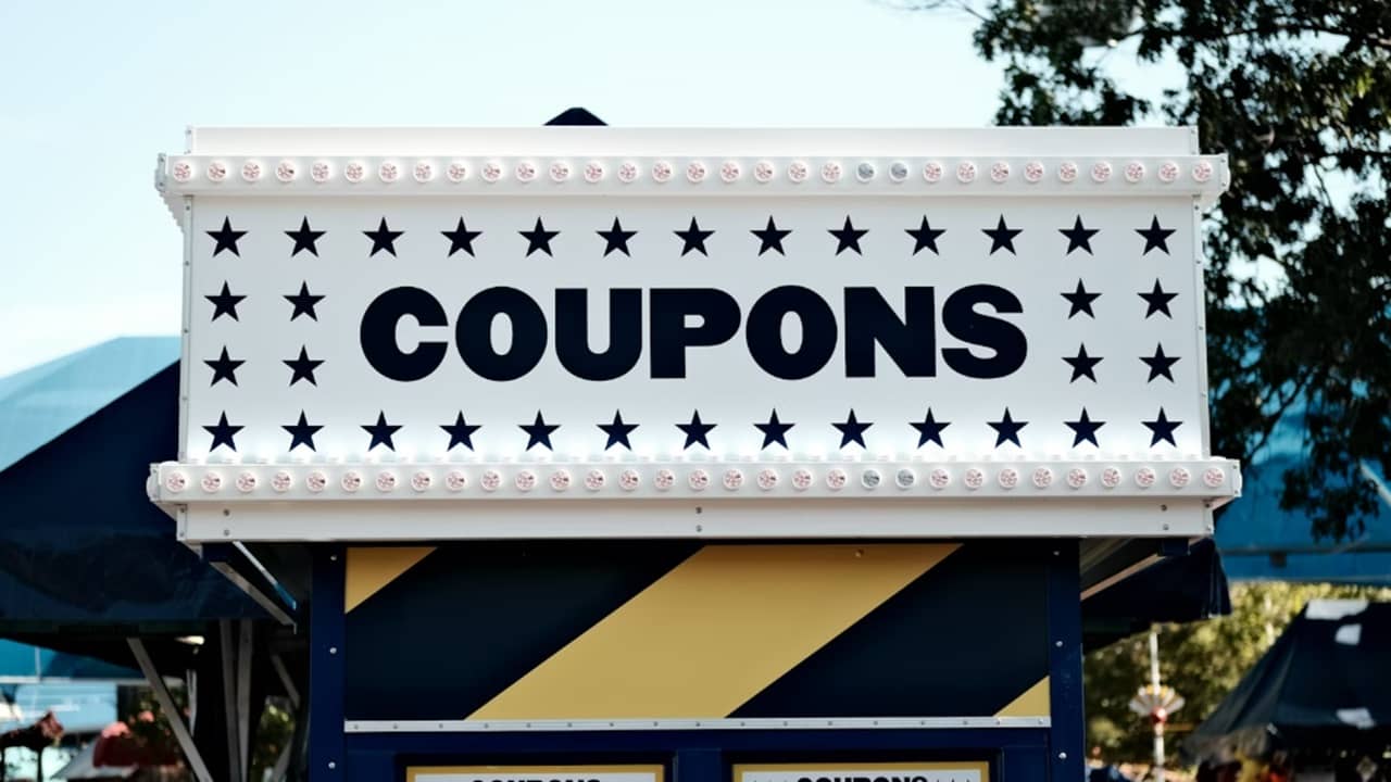 A sign advertising coupons.