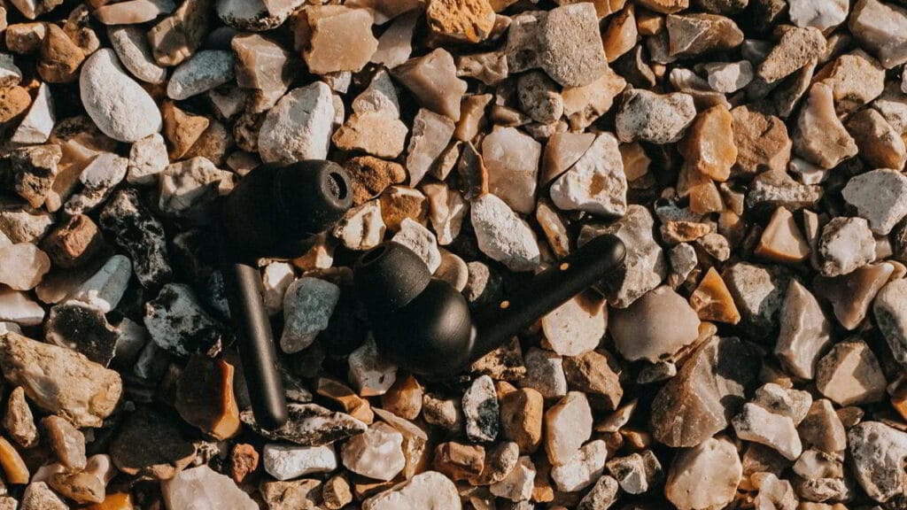 black earbuds with stones in the back