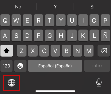 Appuyer sur l'icône de type globe dans le clavier iPhone pour changer la langue.