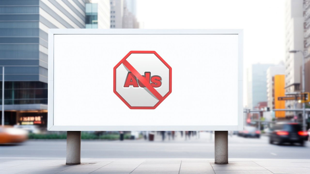 A street billboard with no ads icon in middle
