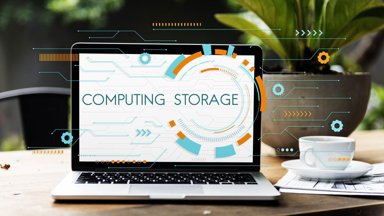 laptop on a table with computing storage text