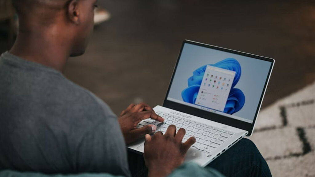 Man using Windows 11 on a laptop.