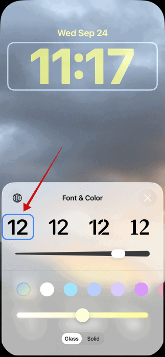 Passage à la première option de police sur l'écran de verrouillage de l'iPhone.