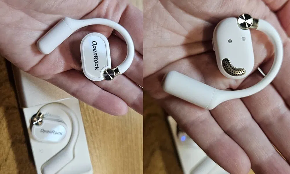 Écouteurs OpenRock X à la main.