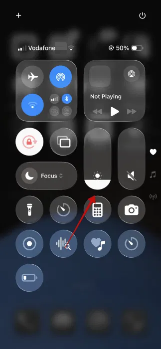 Réduire la luminosité de la barre de luminosité de l'iPhone