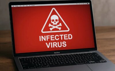 Image featuring a realistic MacBook with an infected virus sign on the screen.
