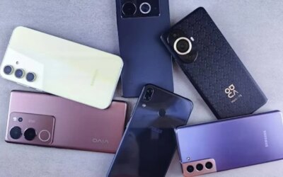 Collection of old phones on a table.