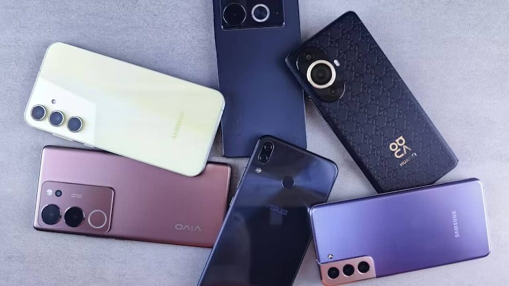 Collection of old phones on a table.