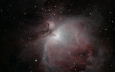 Stunning capture of the Orion Nebula (M42) with sparkling stars and vibrant emission clouds.