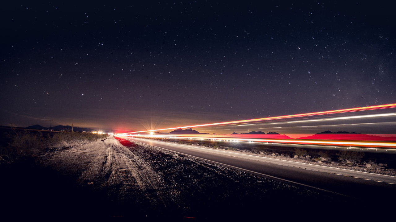 Time lapse photography of vehicles on road